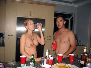 Wild and drunk young girlfriends having fun topless